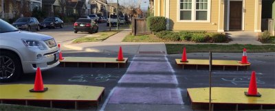 Some sidewalk chalk, orange cones, and raised platforms
